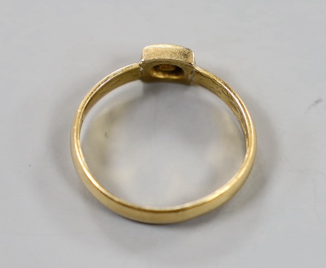 A Victorian 22ct gold and single stone gypsy set ruby ring, size M, gross weight 3.9 grams.